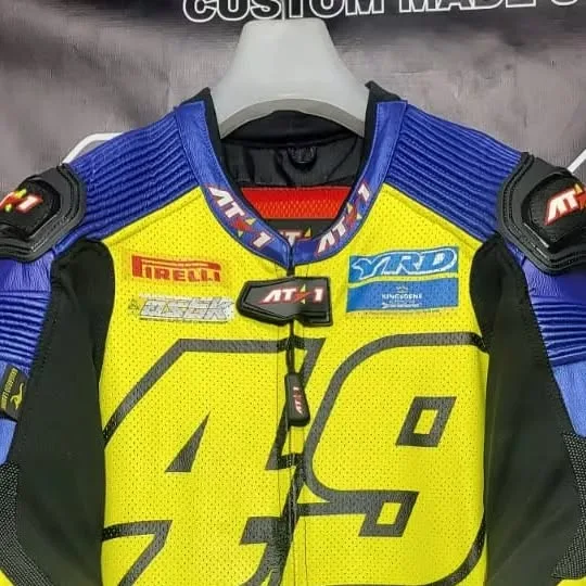 Custom fluo yellow and blue AT1 race suit number 49